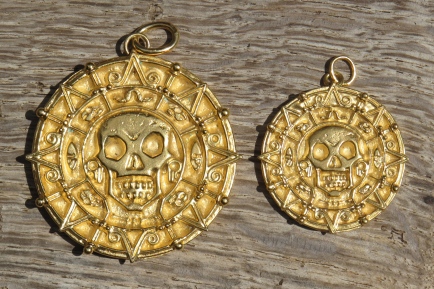 Large and small finished medallions with rings for chain.